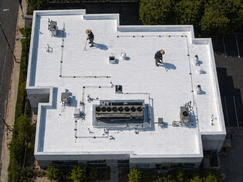 commercial roof replacement completed white flat roof system aerial view by method roofing group southern california