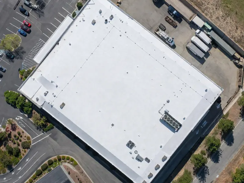 Aerial view of an industrial flat roof installed by Method Roofing Group on a Southern California warehouse facility
