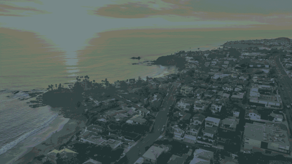Aerial view of Southern California coastal homes and residential rooftops at sunset, Method Roofing Group service area